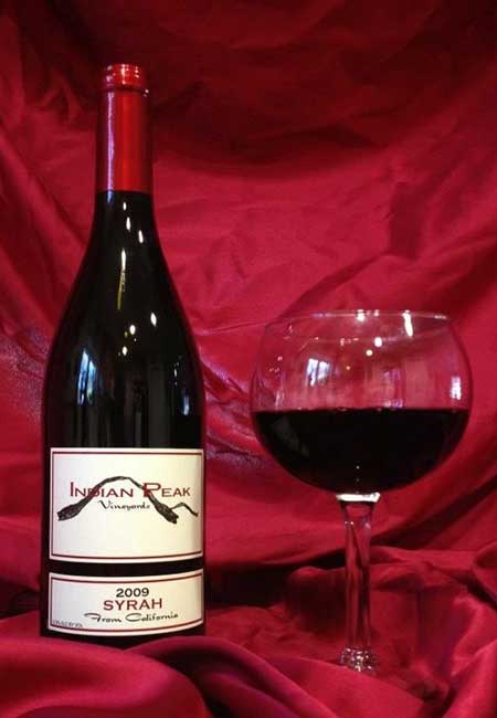 Syrah - 2009 Bottle and Glass of Wine from Indian Peak Vineyards of Manton, Ca. 96059.